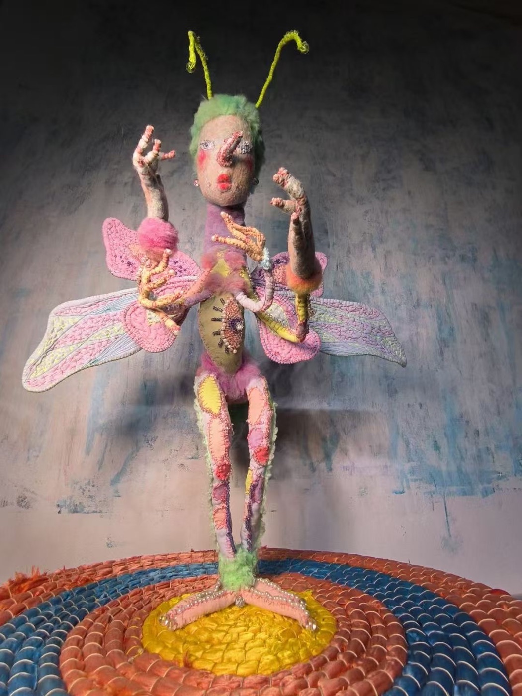 Archive standing winged soft figure with antennae and embroidered pastel body.