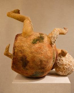 Back view of Broken Jar showing the rounded jar-like body, head, limbs, and warm wool color.