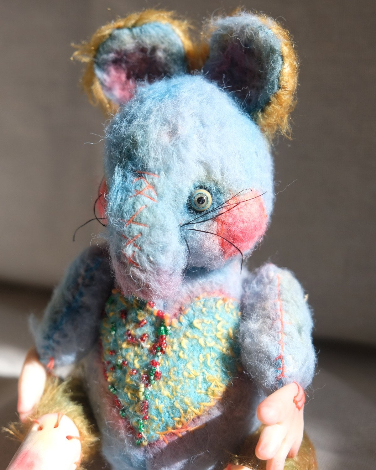 Front view of Dream Thief showing the blue wool body, stitched snout, and black shoes.