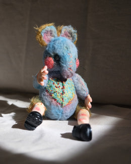 Scale view of Dream Thief as a small collectible handmade art doll.