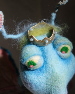 Top detail of King Aster showing the crown, fuzzy wool surface, and heart antennae.